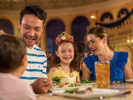 Smiling family eating dinner