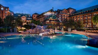 A view of the main pool at the Wilderness Lodge at night.