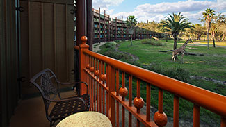 Savannah View room balcony with a giraffe in the background